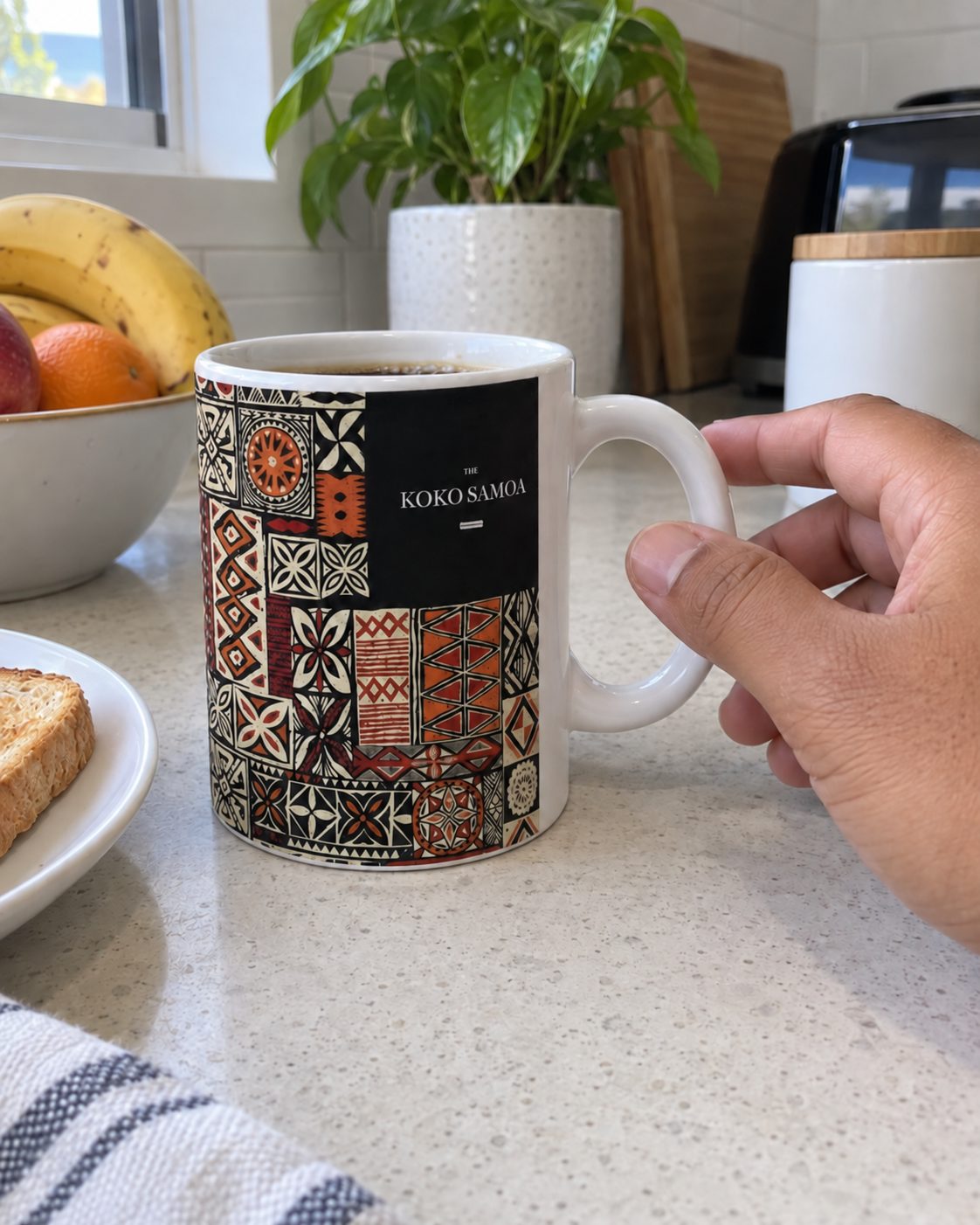 Mug 325ml in the Elei print, on a kitchen bench in the morning.