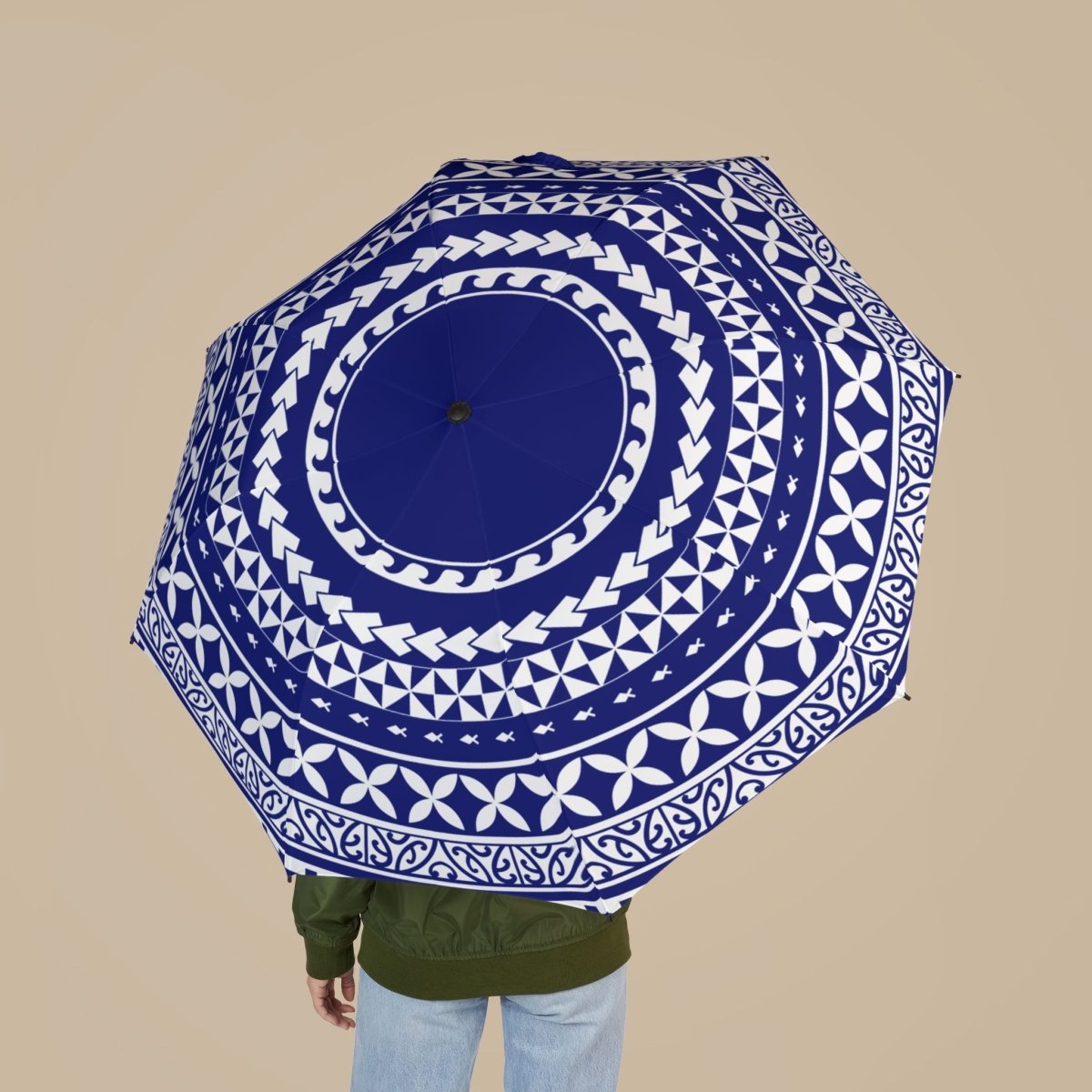 Artsadd PasifikaOne umbrella, 48-inch wide, in vibrant United Blue with intricate Polynesian-inspired patterns, perfect for rain or sun.