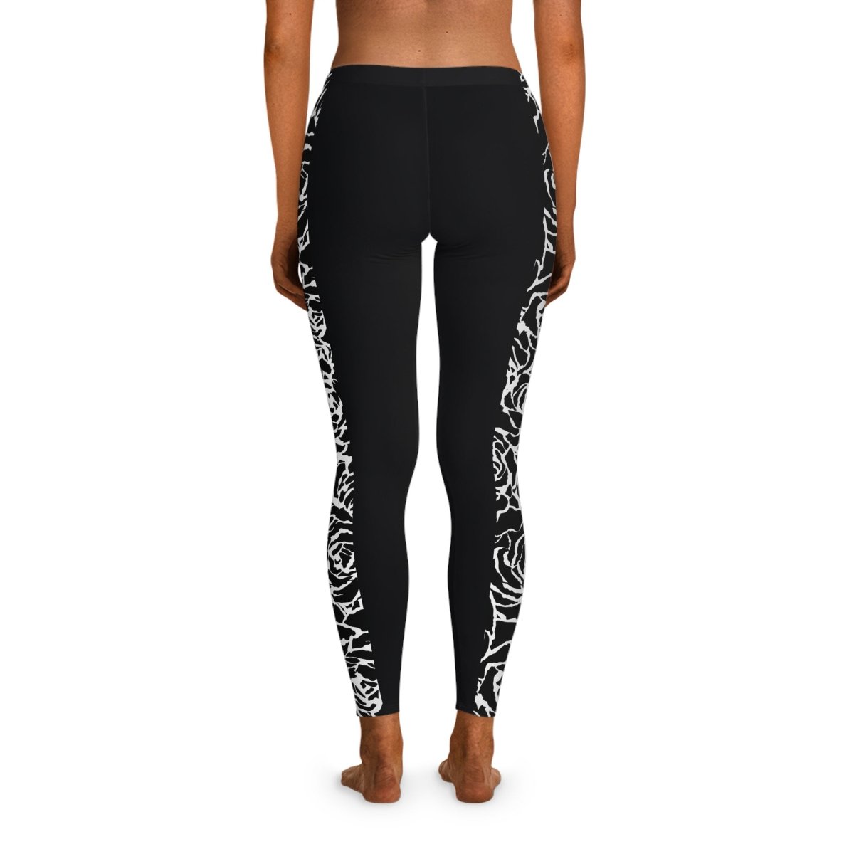 Black FYBY IslandFlex mid-rise leggings with a Faleasiu Nights pattern, shown on a model, highlighting the comfortable fit and design.