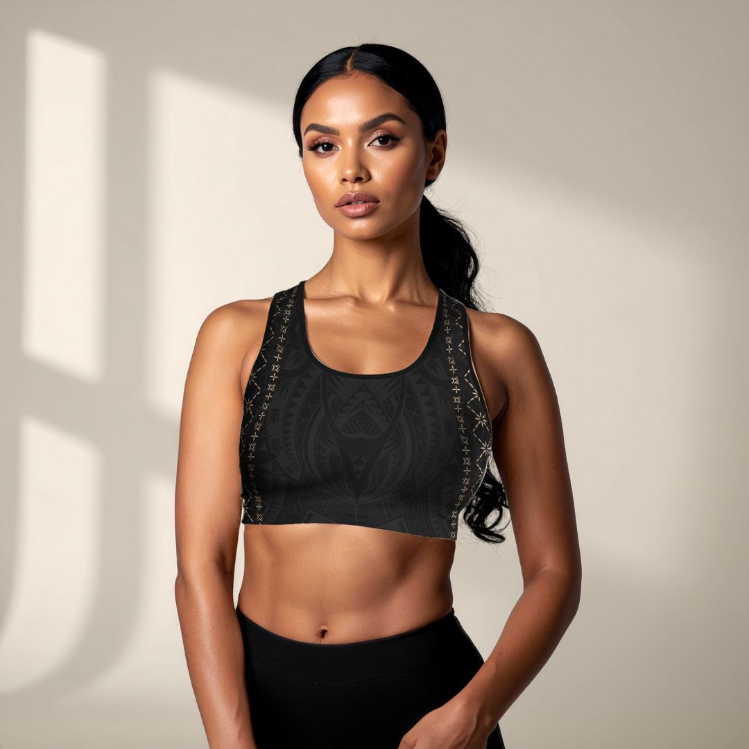 Black seamless sports bra by FYBY with subtle stitching, designed for comfort and support during workouts.