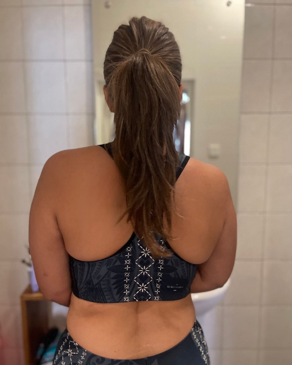 Black FYBY Malu seamless sports bra with subtle stitching, designed for comfort and support during athletic activities.