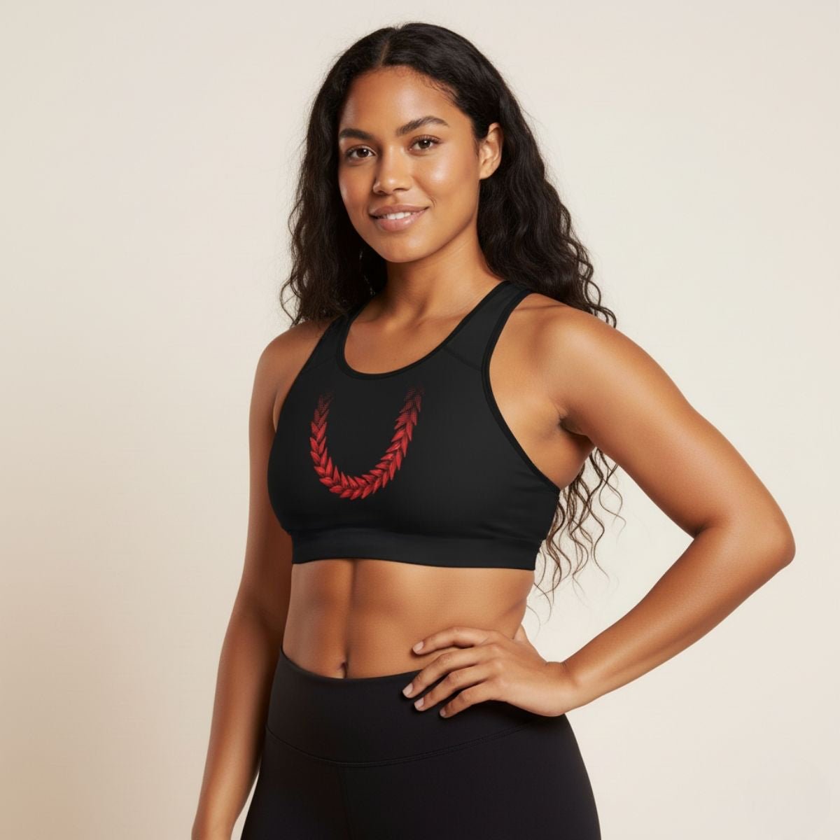 Black seamless sports bra by FYBY featuring subtle stitching, designed for comfort and support during active workouts.