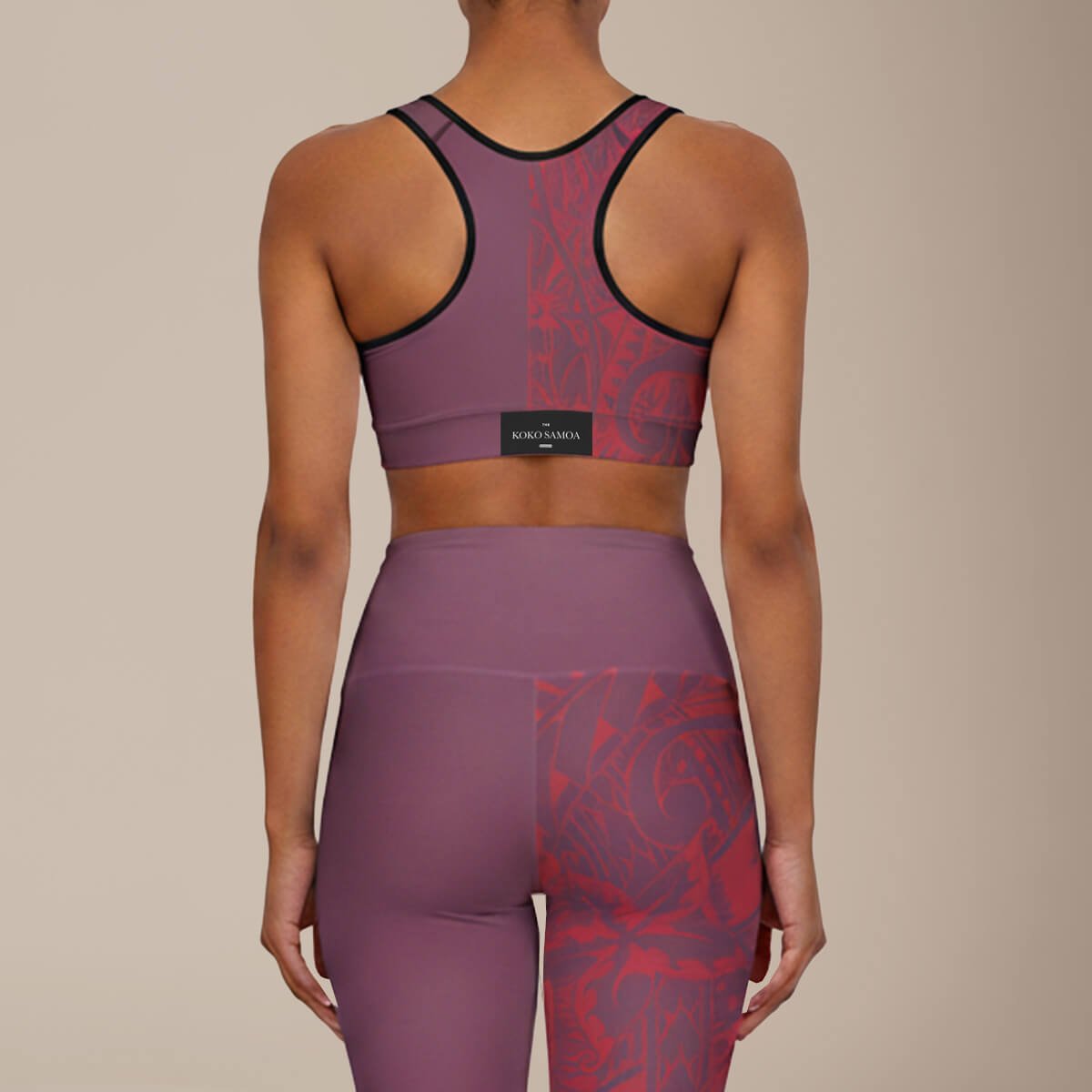 FYBY sports bra in Winterberry Red with black stitching, designed for active wear, shown in a close-up shot.