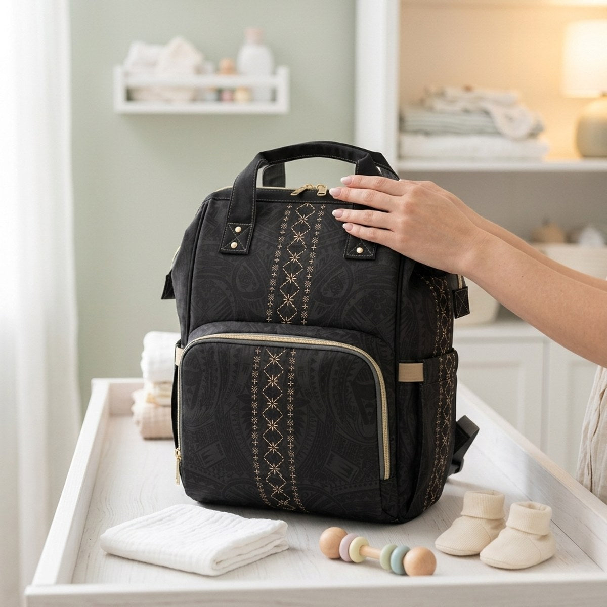 Malu diaper bag on a nursery change table with baby essentials