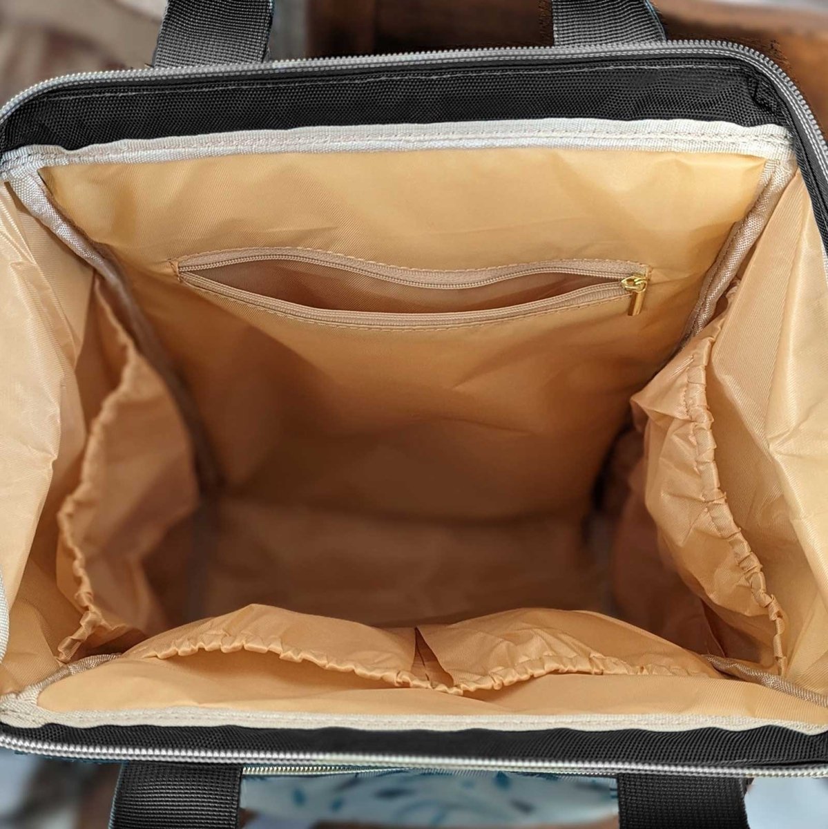 Artsadd Malu multipurpose diaper bag with multiple compartments and adjustable straps, designed for parents on the go.