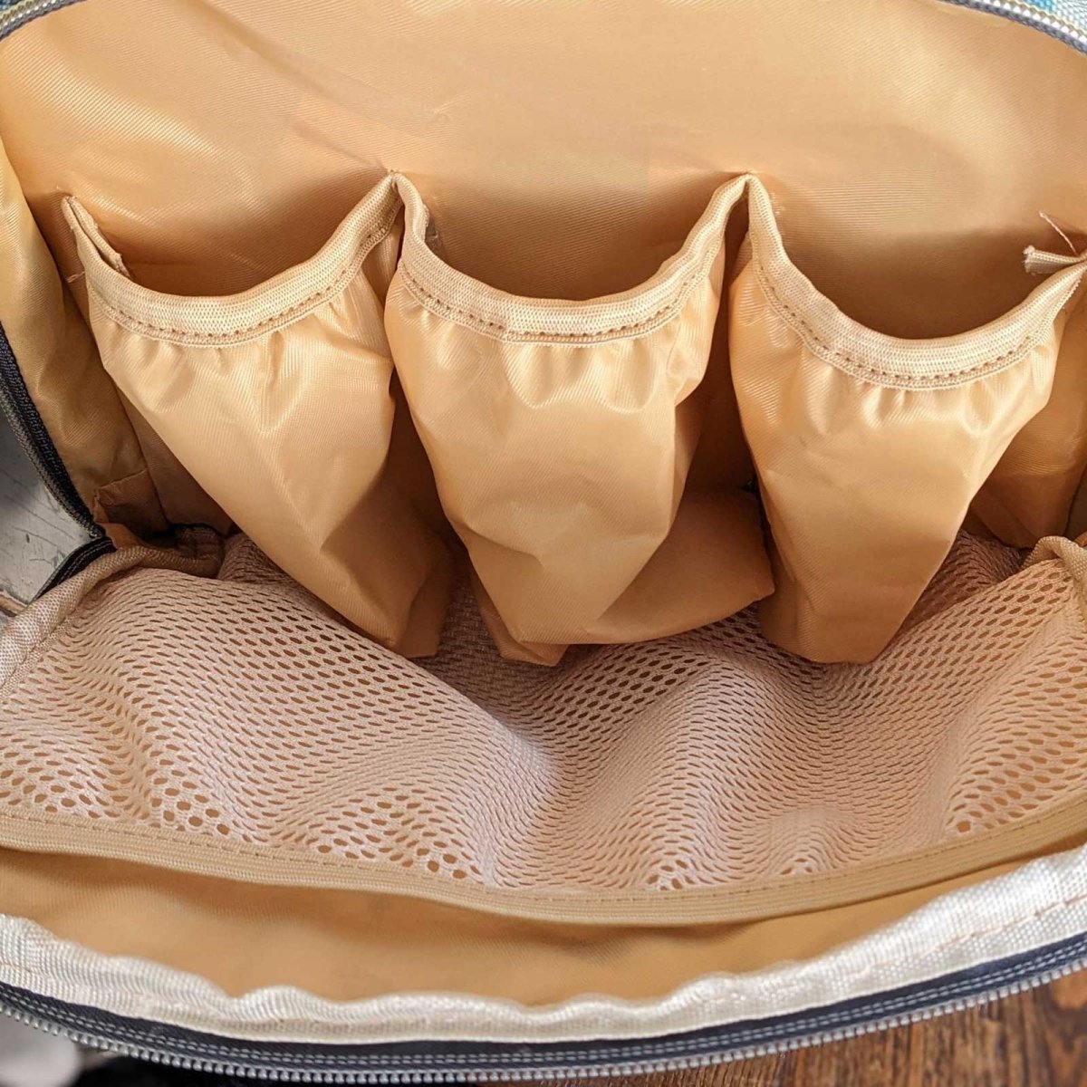 Artsadd Malu multipurpose diaper bag with multiple compartments, stylish design, and adjustable straps for convenient baby care.