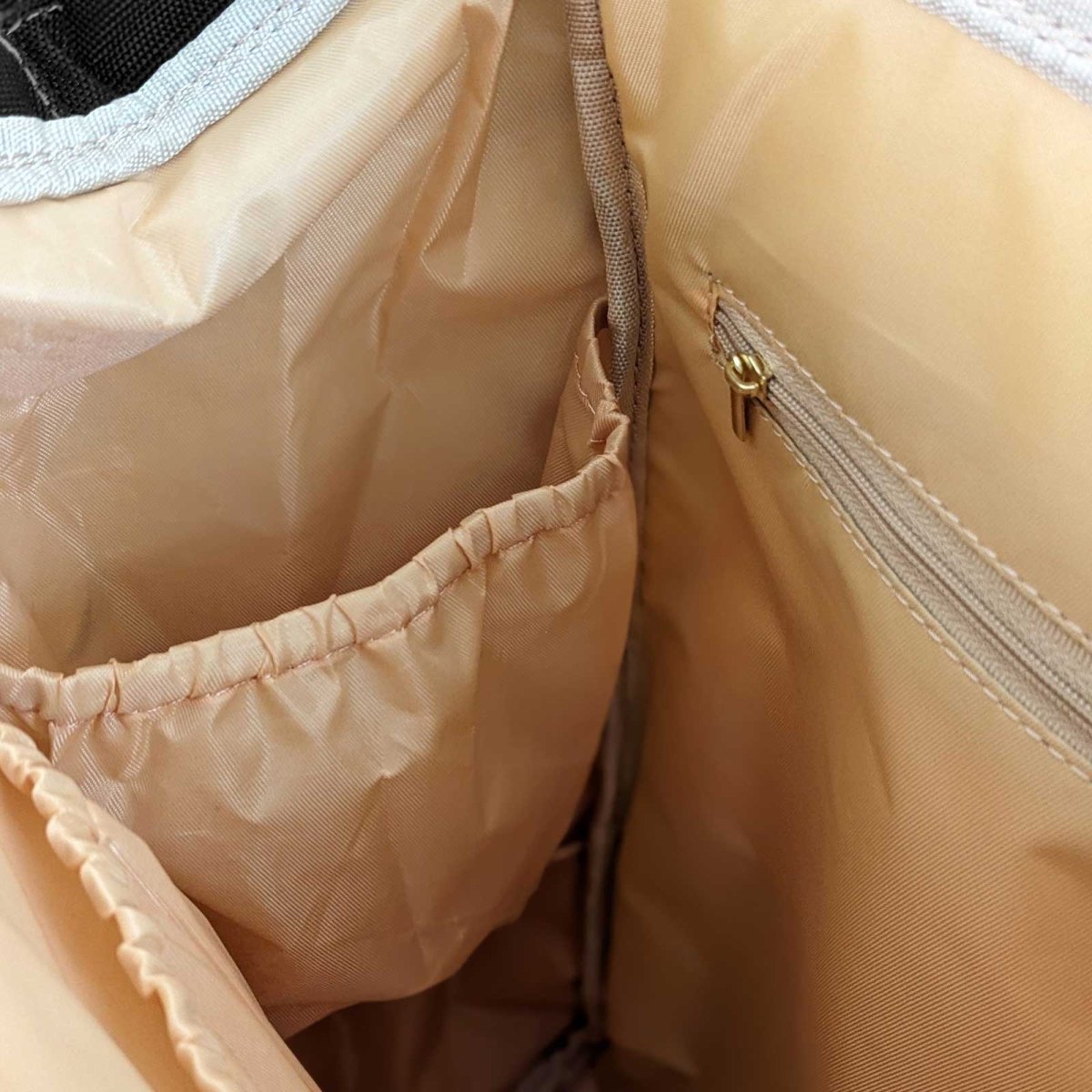 Artsadd Malu multipurpose diaper bag with multiple compartments, stylish design, and adjustable straps for parents on the go.