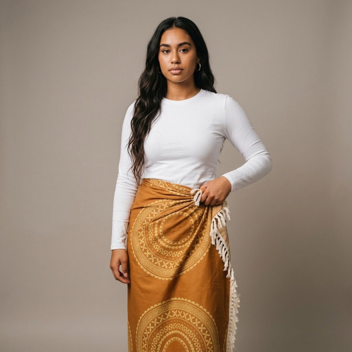 Golden sun-patterned multipurpose lavalava featuring vibrant tropical design, ideal for versatile wear.