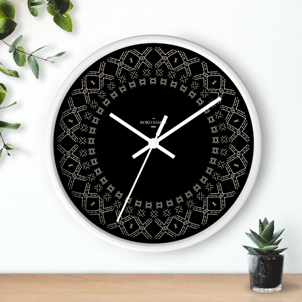 Black and white 10-inch Malu wall clock, featuring a sleek design for home decor in AU, NZ, and USA styles.