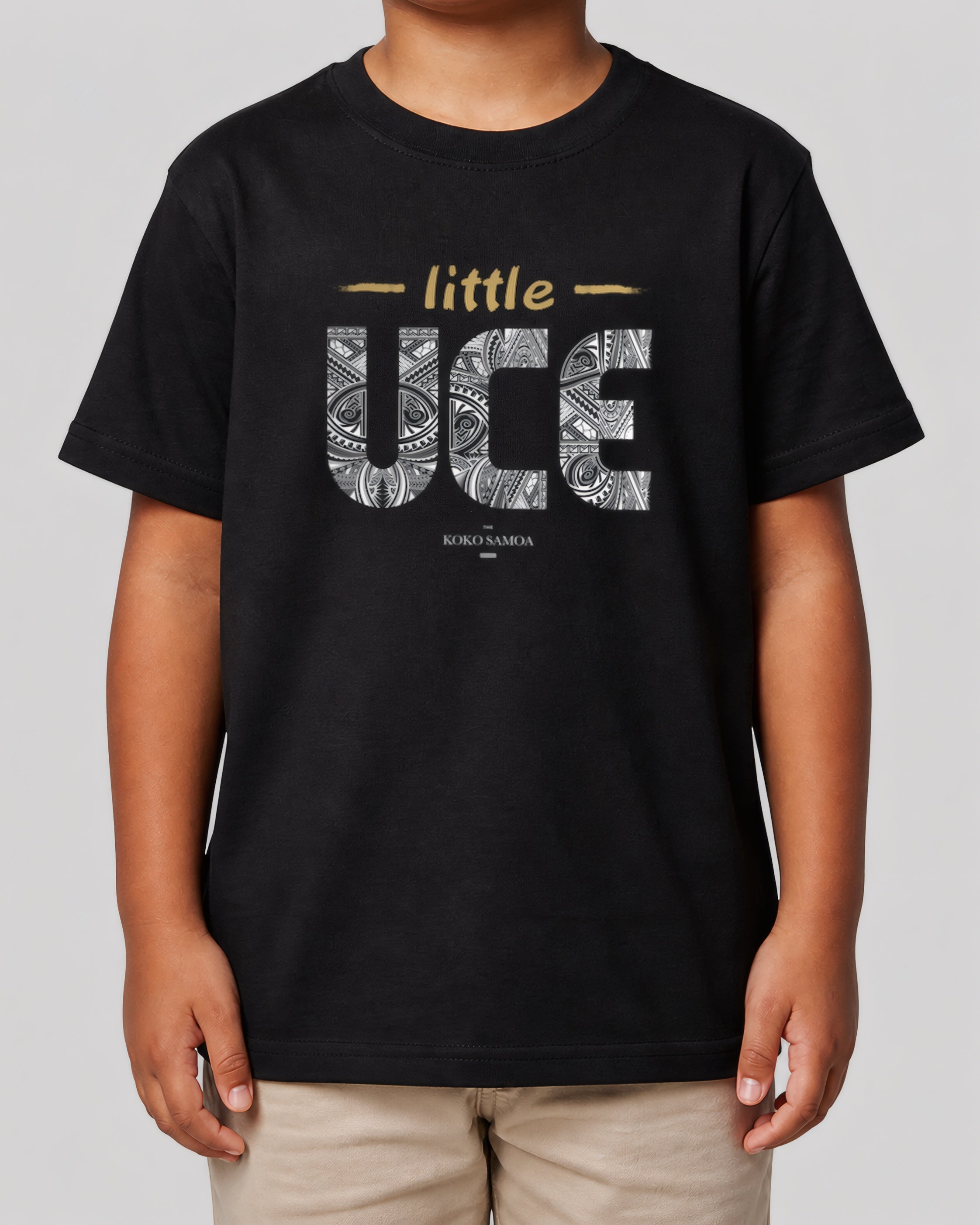 Kids Unisex Tee - Little Uce on a light grey studio background