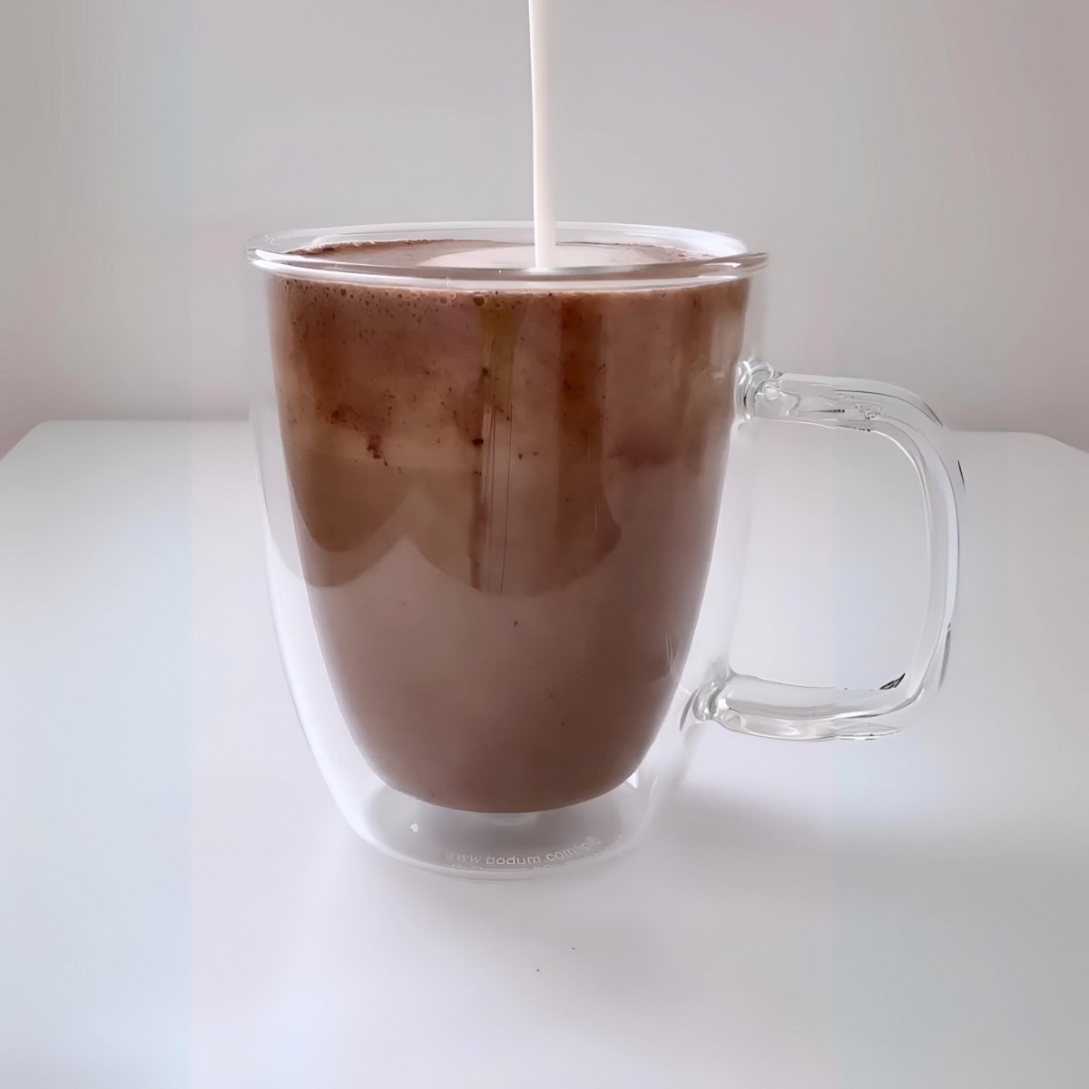 Instant Koko Samoa drinking chocolate by THE KOKO SAMOA, smooth cocoa powder in a jar for rich hot chocolate.