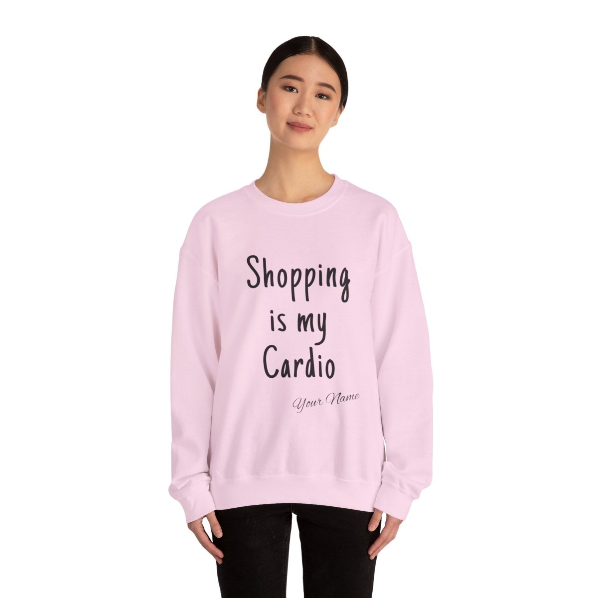Unisex heavy sweatshirt with "Shopping is My Cardio" printed, branded by The Print Bar, in black fabric.