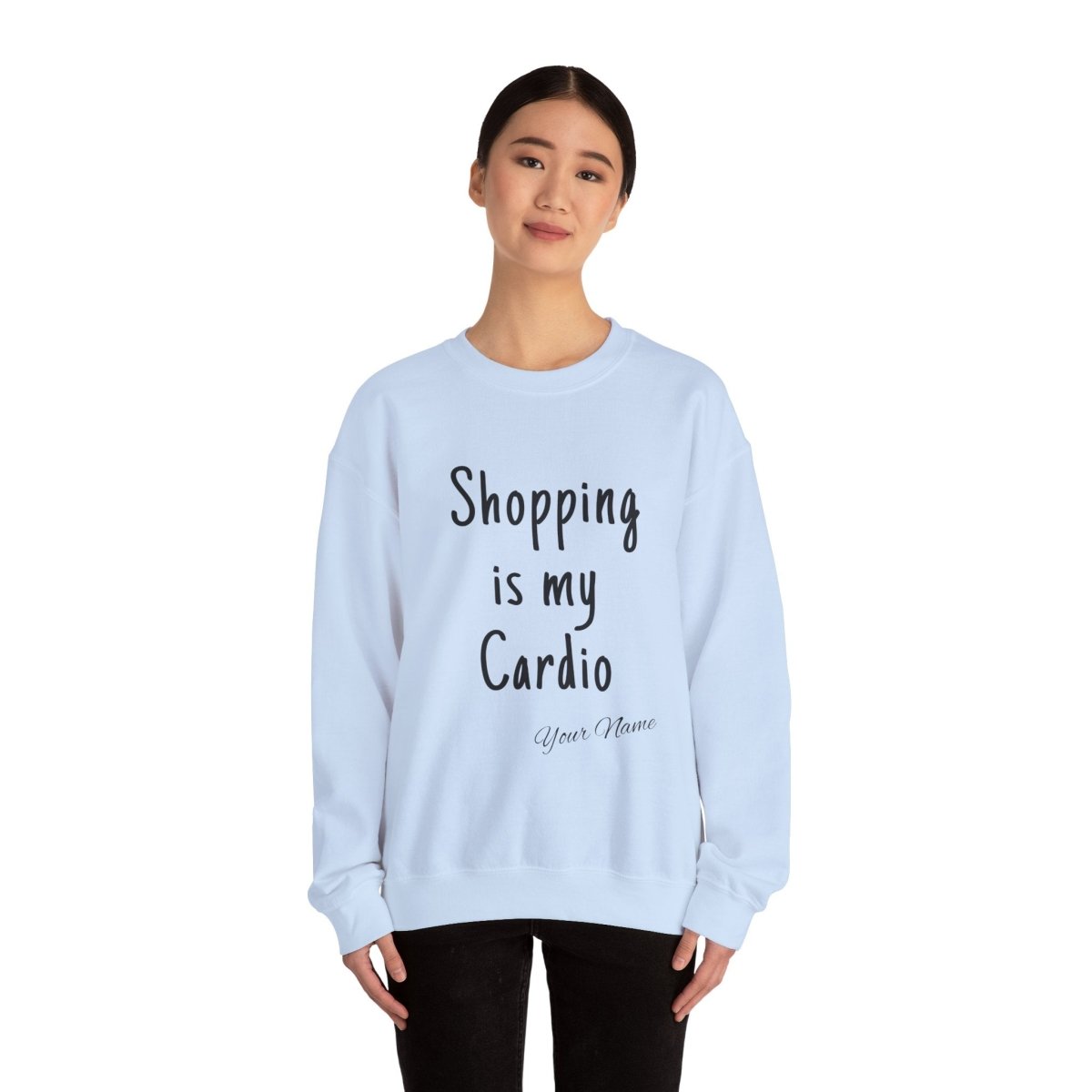 Unisex heavy sweatshirt with "Shopping is My Cardio" slogan, by The Print Bar, in a cozy, casual style.
