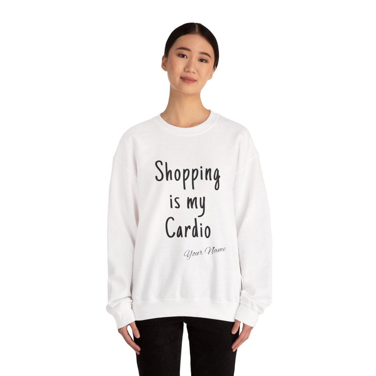 Unisex heavy sweatshirt with "Shopping is My Cardio" printed, from The Print Bar, in black with white text, front view.