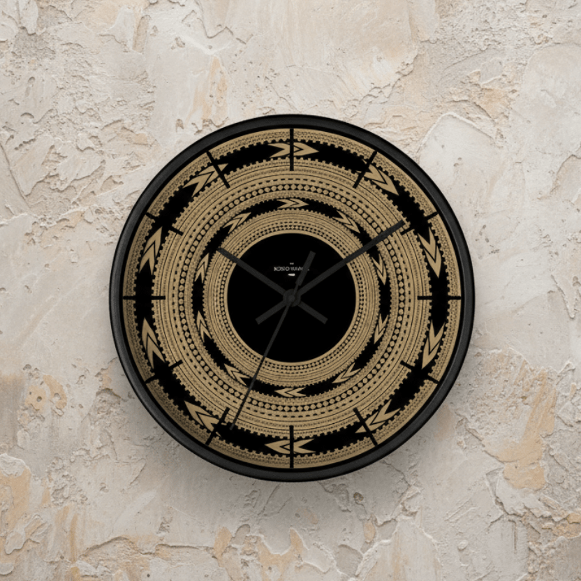 Round 10-inch Pe'a wall clock with Samoa-inspired design, featuring bold black hands and colorful tribal patterns.