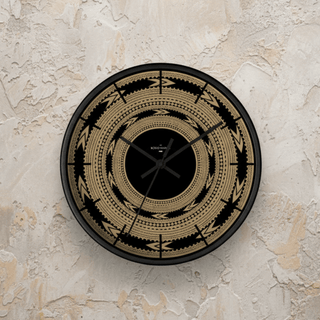 Round 10-inch Pe'a wall clock with Samoa-inspired design, featuring bold black hands and colorful tribal patterns.